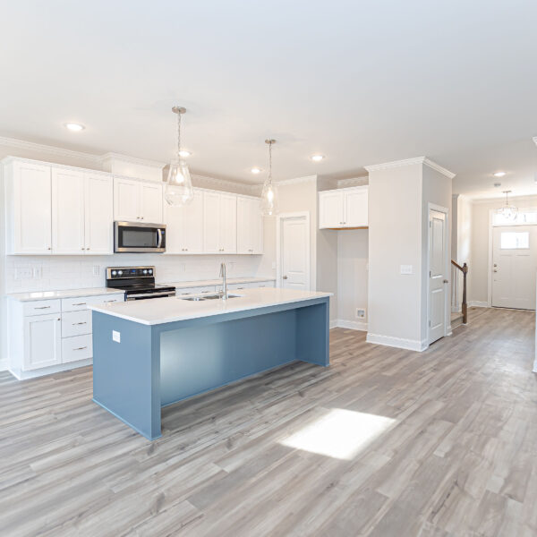 Winslow Custom Homes Kitchen with light blue island and white cabinets