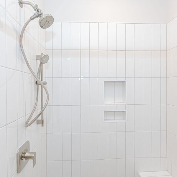 Custom Home Builder Unique Bathroom white tile bath