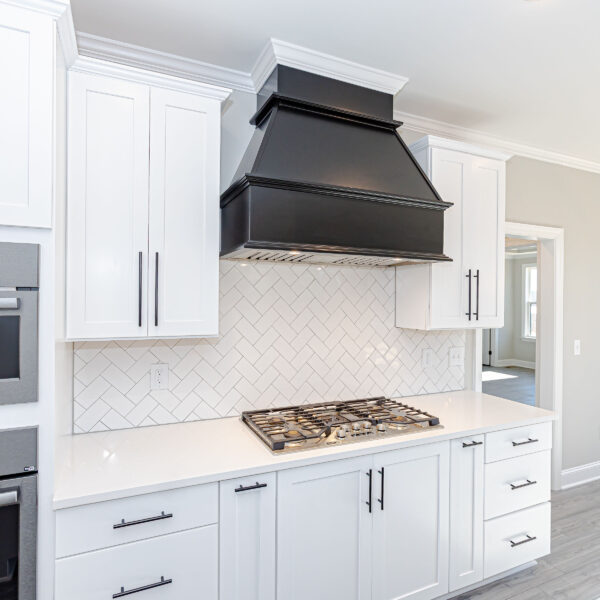 Winslow Custom Homes Kitchen with white tile and black hood