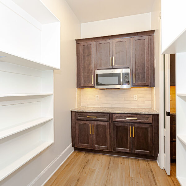 Winslow Custom Homes Pantry with microwave and cabinets