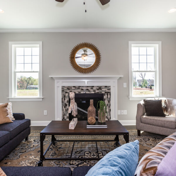 Winslow Custom Homes Living Room with fireplace and two windows