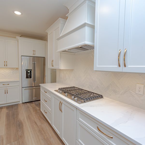 Winslow Custom Homes White cabinets with gold hardware