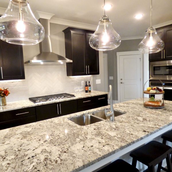 Winslow Custom Homes Black cabinets with granite countertops